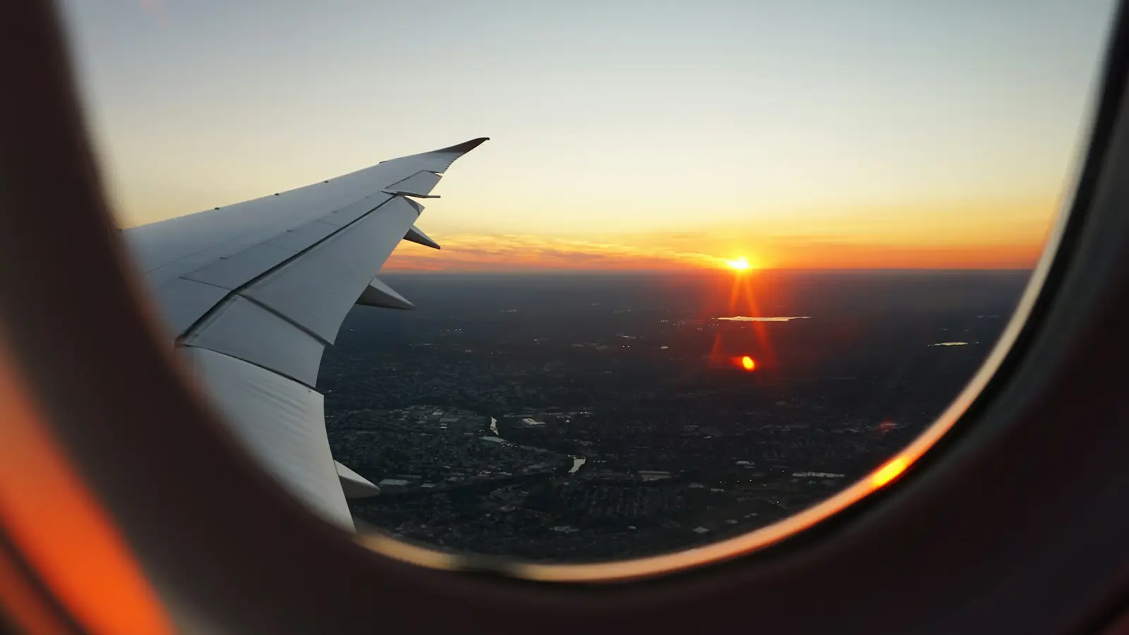 View from an aircraft window at sunrise