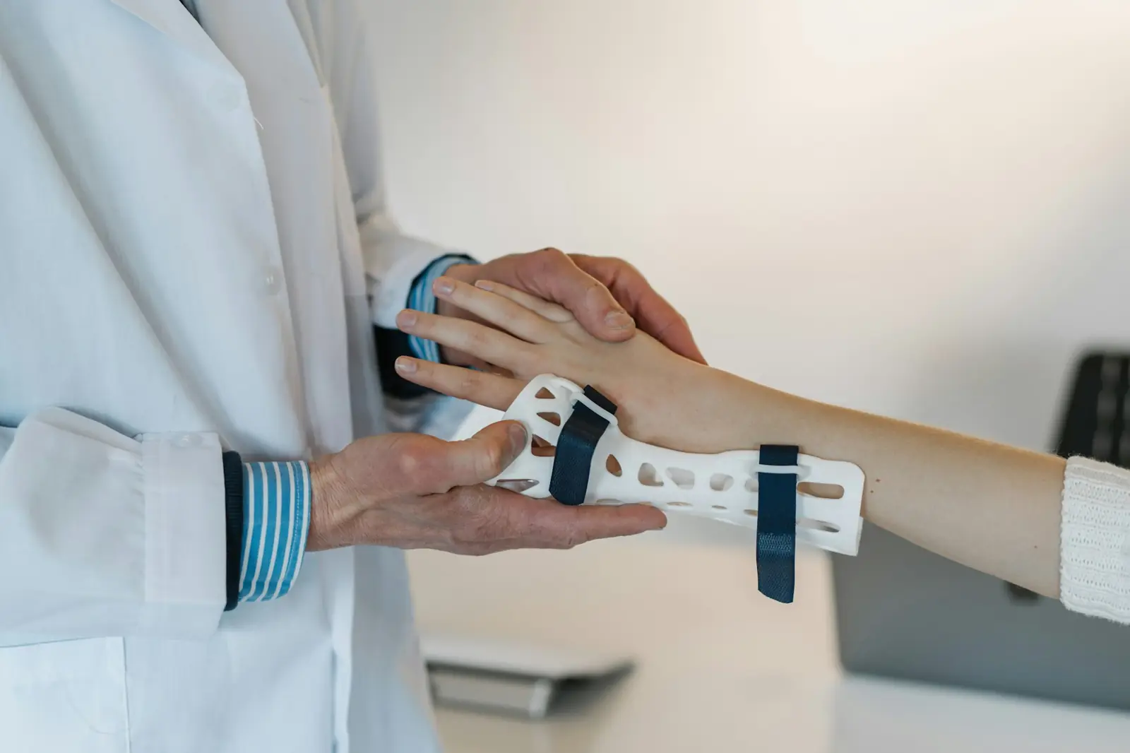 Clinician fitting a wrist support